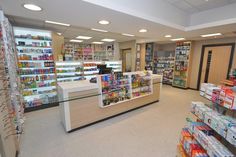 the inside of a store filled with lots of shelves full of food and drink items