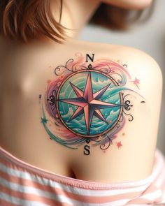 a woman with a compass tattoo on her shoulder