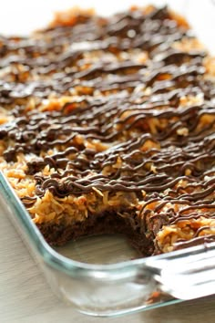 a glass dish filled with chocolate and oatmeal dessert