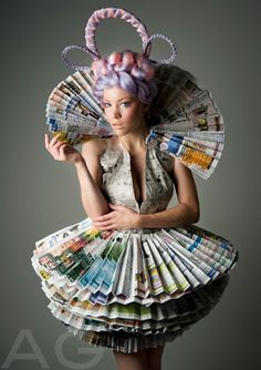 a woman in a dress made out of newspapers