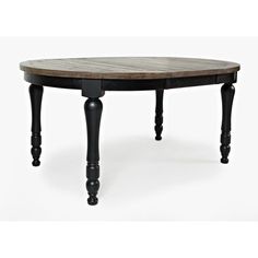 an oval wooden table with black legs