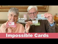 an older man and woman holding up cards with the words impossibleible cards in front of them