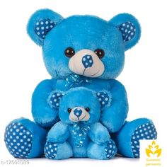 two blue teddy bears sitting next to each other with polka dots on their furs