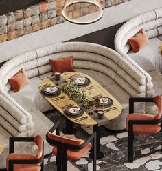 an overhead view of a dining room with couches, tables and chairs