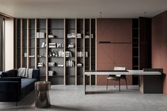 a living room filled with furniture and bookshelves next to a large glass window