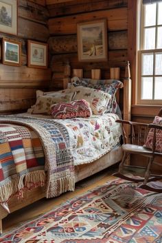 a bed sitting in a bedroom on top of a wooden floor next to a window