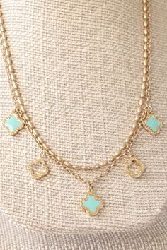 Add a touch of style to any outfit with our layered Clover necklace. Featuring a rice ball chain and five Clover charms in worn gold tone, this set creates a fun and updated look. The shorter necklace measures 17", while the longer necklace is 18", making them the perfect length for any ensemble. The Clover charms measure 0.5"-0.6" and are secured with a lobster claw closure and extender. Trust our expertise and elevate your wardrobe with this must-have accessory. Lily Grace, Beauty Gift Card, Rice Ball, Clover Charm, Clover Necklace, White Turquoise, Short Necklace, Ball Chain, Beauty Gift