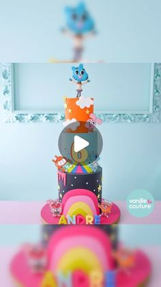 there is a multi layer cake decorated with cartoon characters and rainbows on the top