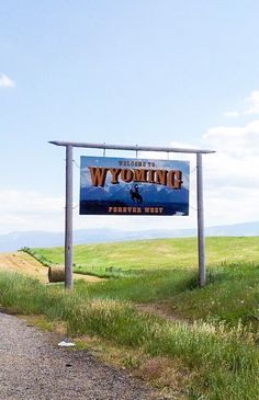 a sign on the side of a road that says wyoming