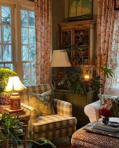 a living room filled with lots of furniture and windows covered in curtains next to each other