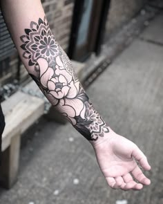 a person with a flower tattoo on their arm