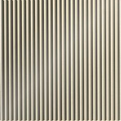 a white wall with vertical lines painted on it