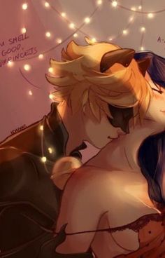 two people are kissing in front of some string lights