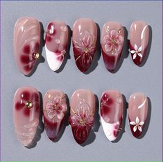 White Red Gold Nails, Winter Flower Nail Designs, Almond Nails Red And White, Red Nails With Flower Design, Red 3d Flower Nails, Spider Lily Nails, Almond Red French Tip, Winter Gel Nail Designs, 3 D Flower Nails