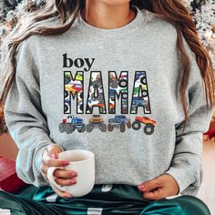 This Cozy Boy Mama Matching Sweatshirt and t-shirt with Big Monster Trucks Theme  is sure to be a favorite gift for mom and son.  Perfect for boy baby shower gifts or new mom boy gifts, boys birthday or mom's birthday. These Matching Mother and Son Mama's Boy shirts are too cute and can be paired with Boy Mama Sweatshirt.  Also Tees and Baby Bodysuits.  MATCHING COMFORT COLORS SHORT AND LONG SLEEVES: https://www.etsy.com/listing/1496514221 FOR MATCHING COMFORT COLORS SWEATSHIRTS: https://www.ets Boy Mama Sweatshirt, Graphic Print Sweatshirt For Birthday And Mother's Day, Mother's Day Birthday Graphic Print Sweatshirt, Mother's Day Birthday Crew Neck Sweatshirt, Monster Truck Jam, Big Monster Trucks, Boy Mom Shirt, Monster Truck Theme, Big Monster