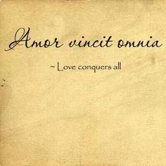 an old piece of paper with the words love conquers all