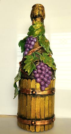 a wooden basket filled with lots of grapes