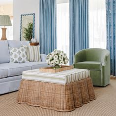 a living room filled with furniture and curtains