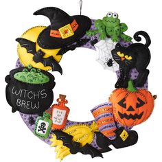 a wreath decorated with witches and pumpkins