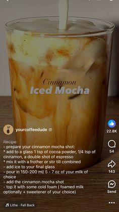 an ice mocha in a cup with a straw sticking out of it