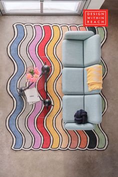 an overhead view of a living room with colorful rugs