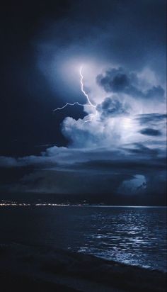 a storm is coming over the ocean and it looks like they are in the sky