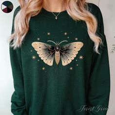 Vintage Moth and Stars Unisex Sweatshirt | Celestial Moth Jumper | Boho Clothes | Autumn Sweatshirt  ✔️ Super comfy unisex heavy blend crewneck sweatshirt  ✔️ 50% cotton 50% polyester ✔️ Medium-heavy fabric (8.0 oz/yd² (271.25 g/m ✔️ No side seams ✔️ Ribbed knit elastic collar to help collar retain its shape ✔️ Sewn-in label 📏 Runs true to size ✨ Care instructions: Machine wash: cold (max 30C or 90F). Turn inside out before washing to protect the print. Non-chlorine: bleach as needed. Tumble dr Clothes Light Academia, Moth Graphic, Moth Sweater, Graphic Clothing, Cottagecore Clothes, Light Academia Aesthetic, Light Academia, Fall Sweatshirt, Sew-in Labels