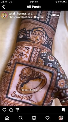 the hand is decorated with henna designs and words that spell out'love '