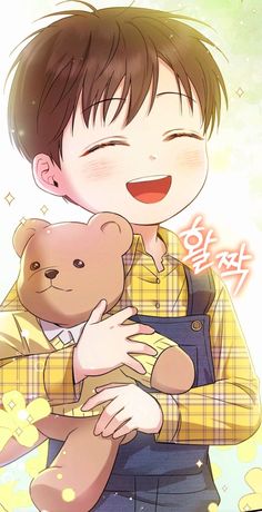 a boy holding a teddy bear in his arms