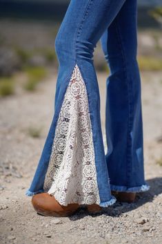 a woman's legs in jeans and heels with lace on the bottom part of her pants