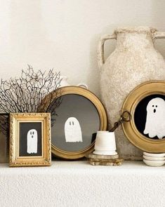 there are two framed pictures with ghost faces on them