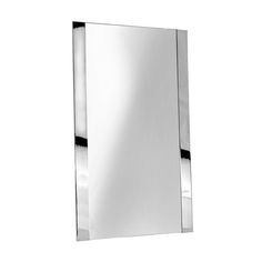 a mirror that is on top of a white wall and has chrome trim around the edges