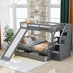 a loft bed with stairs and storage underneath it in a room that has hardwood floors