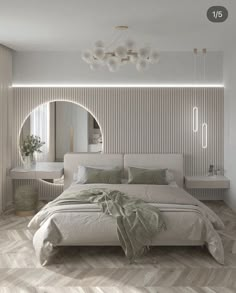 a bedroom with a bed, mirror and lights on the wall next to each other