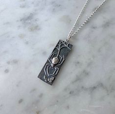 37mm tall sterling silver rectangular spider and moth pendant hanging from a sterling silver chain. Moth, Sterling Silver Chains, Silver Chain, Chain, Sterling Silver, Pendant, Silver