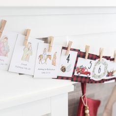 clothes pegs are hanging on the clothes line to display numbers and pictures for children