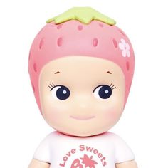 a small toy with a pink strawberry on it's head and the words love sweet is