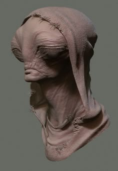 the head and neck of an alien creature with long hair, wearing a pink cloth