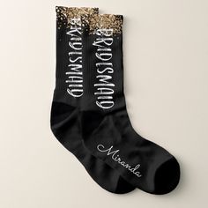 two pairs of black socks with gold sequins and the words mermaid on them