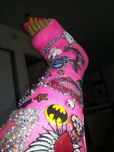 the leg of a person wearing pink and silver sequins