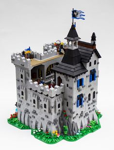 a castle made out of legos on a white surface