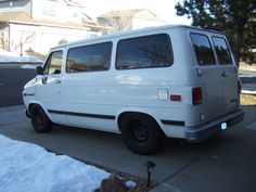 a white van parked on the side of a road