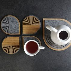 four coasters with coffee cups and saucers on them