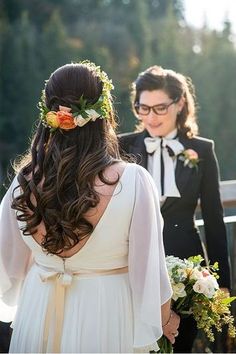 the bride and groom are getting ready to walk down the aisle