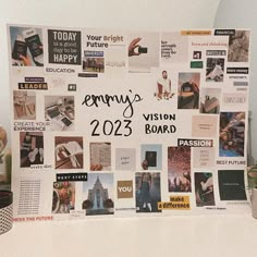 a bulletin board with many different pictures on it and the words emmy's vision board written in black