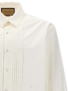 Cotton shirt with pleated plastron, button closure, long cuffed sleeves. Composition: 100% cotton Gucci Formal Button-up Blouse, Gucci Button-up Blouse For Formal Occasions, Gucci Collared Blouse For Spring, Gucci Spring Collared Blouse, Gucci Collared Blouse For Formal Occasions, Gucci Cotton Shirt For Work, Gucci Formal Collared Blouse, Elegant Gucci Button-up Blouse, Classic Gucci Cotton Shirt