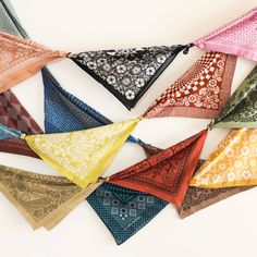 Several rows of brightly colored bandanas tied together like party bunting. Bandana Pennant Banner, Bandana Banner Diy, Bandana Table Decorations, Framed Bandana, Bandana Display Ideas, Bandana Wall Decor, Bandana Decorations, Bandana Garland, Cowboy Party Aesthetic