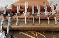 a stack of silverware sitting on top of a book