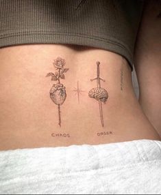 a woman's stomach with two different tattoos on her side and the words chaos order