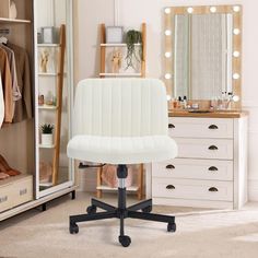 a white office chair sitting in front of a mirror on top of a wooden dresser